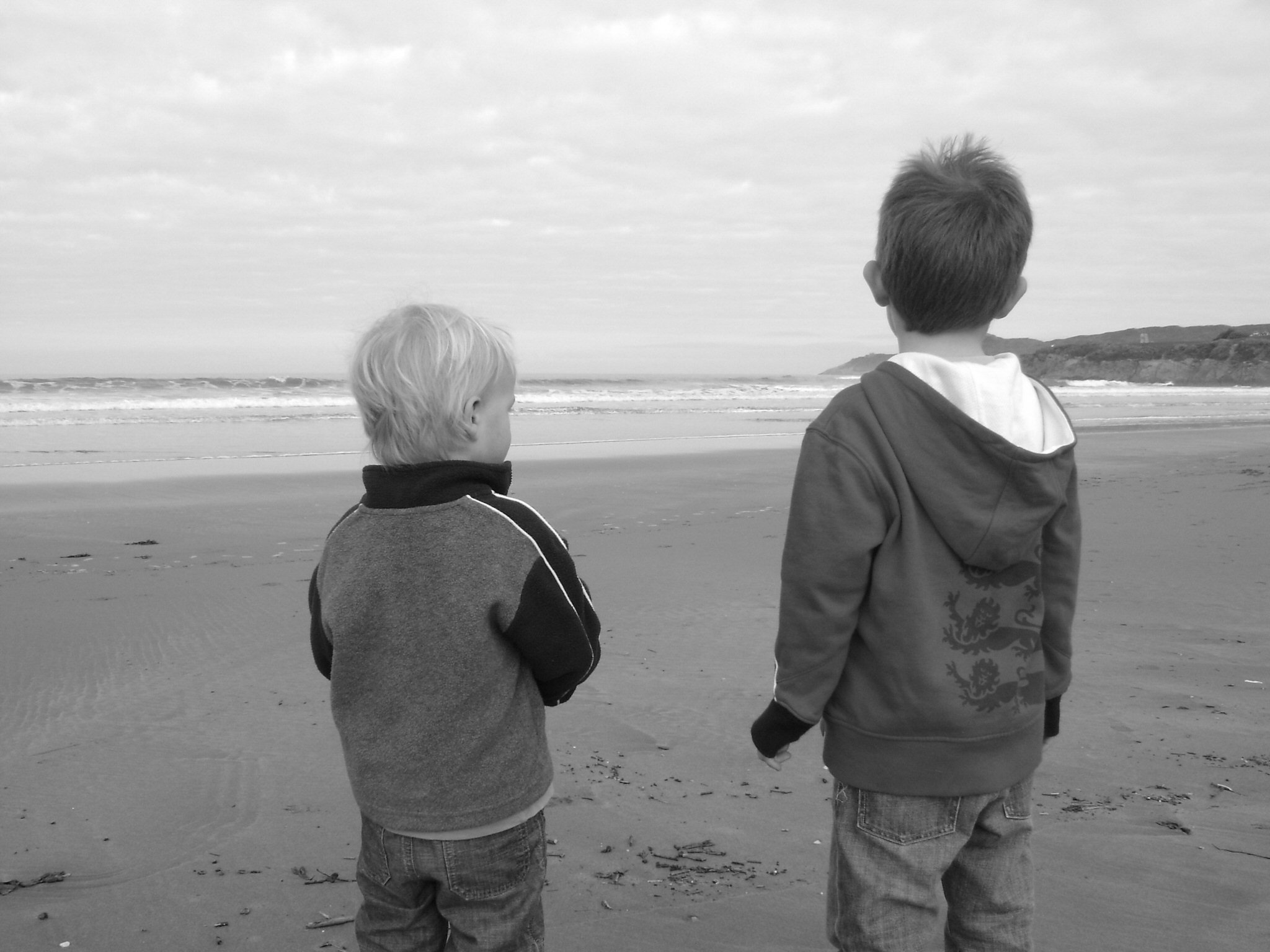 Two young boys on a beach, symbolising family values that drive Adrian's mission